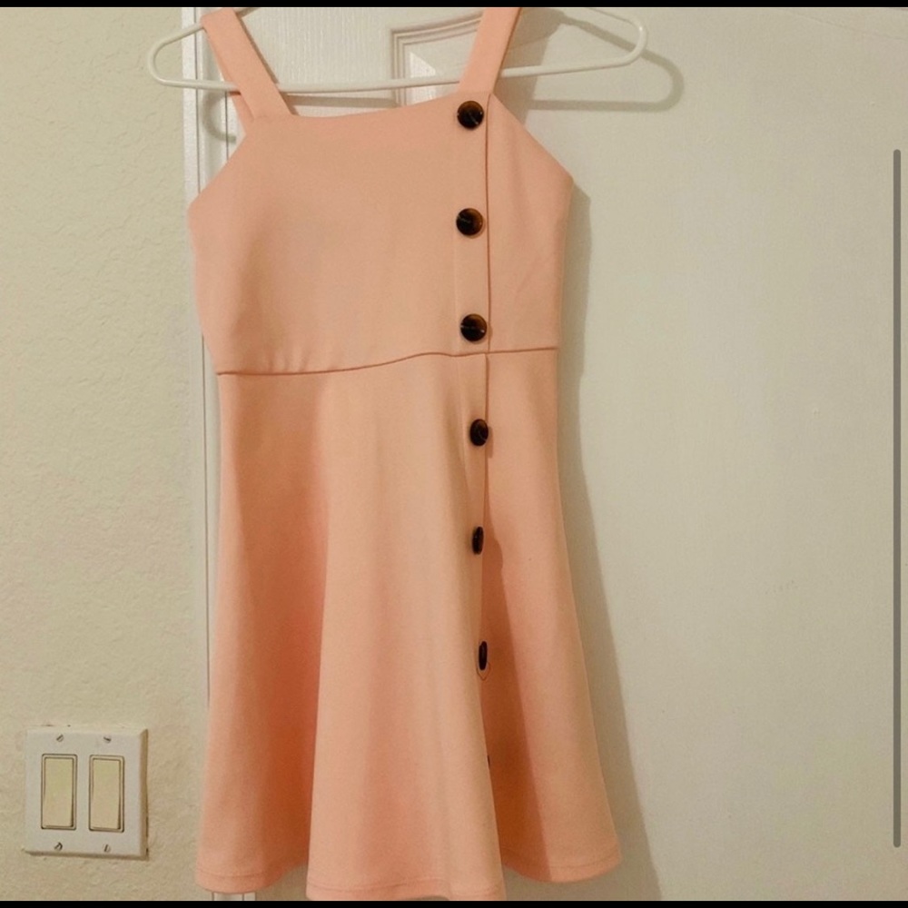 kids pink dress with buttons.